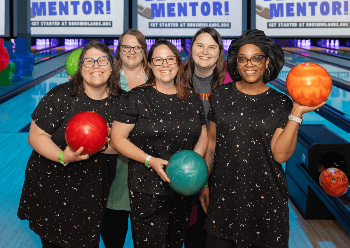 Large group of bowlers posing for a photo.