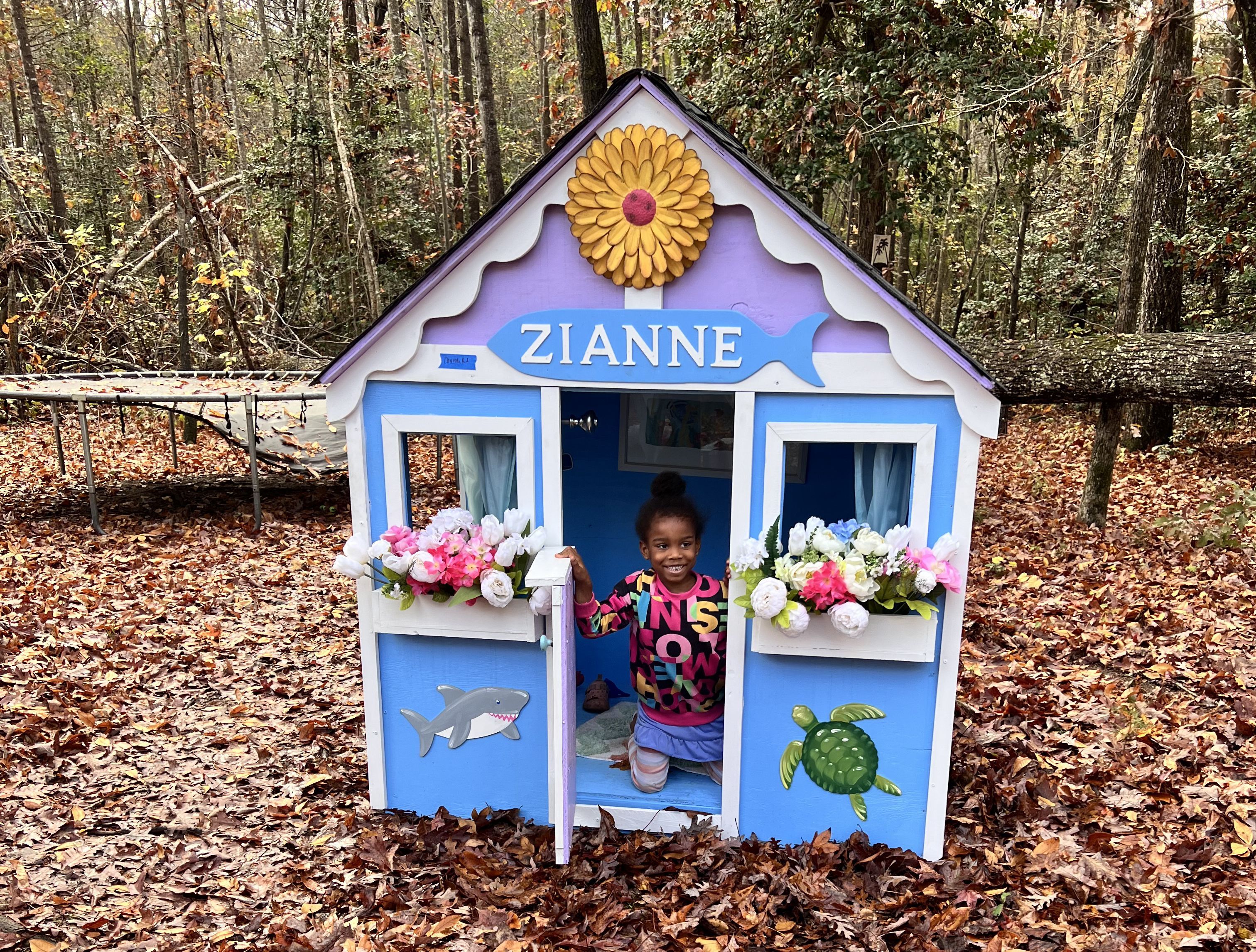 Child plays in custom playhouse