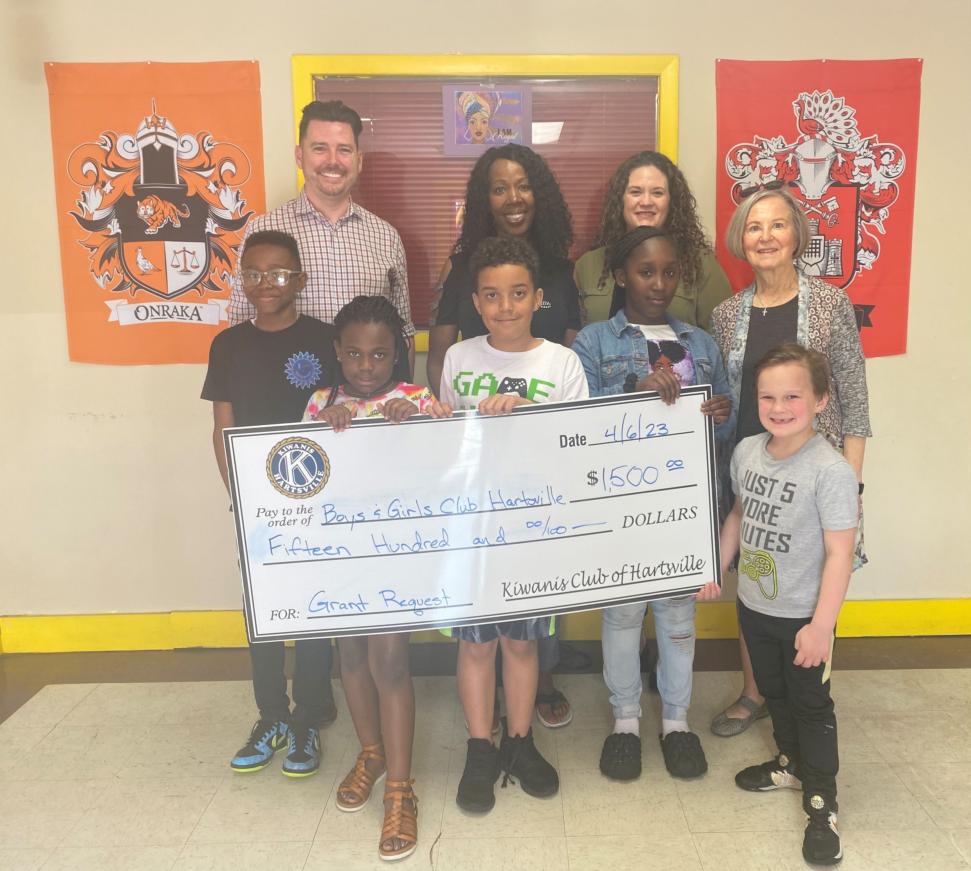 Kiwanis Club Treasurer Craig Weber, and Kiwanis members Brooke Humphries and Nancy McGee present Hartsville Boys & Girls Club Director Dianne Montgomery with a $1,500 grant to help fund the Ron Clark House System at the Club.