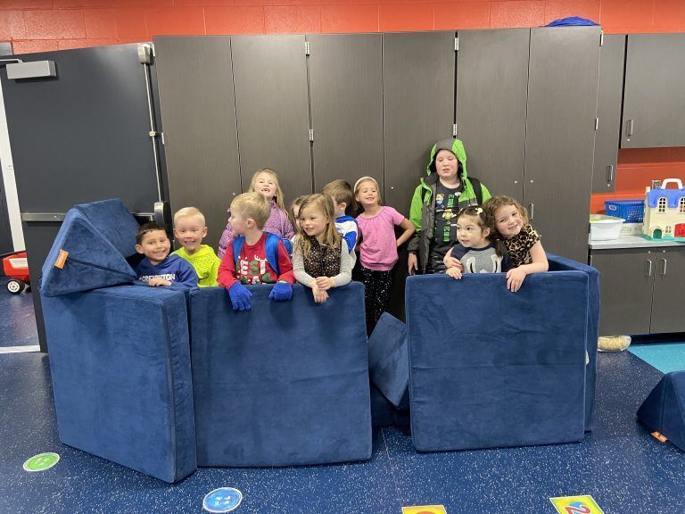 Students playing on Nugget Couches.