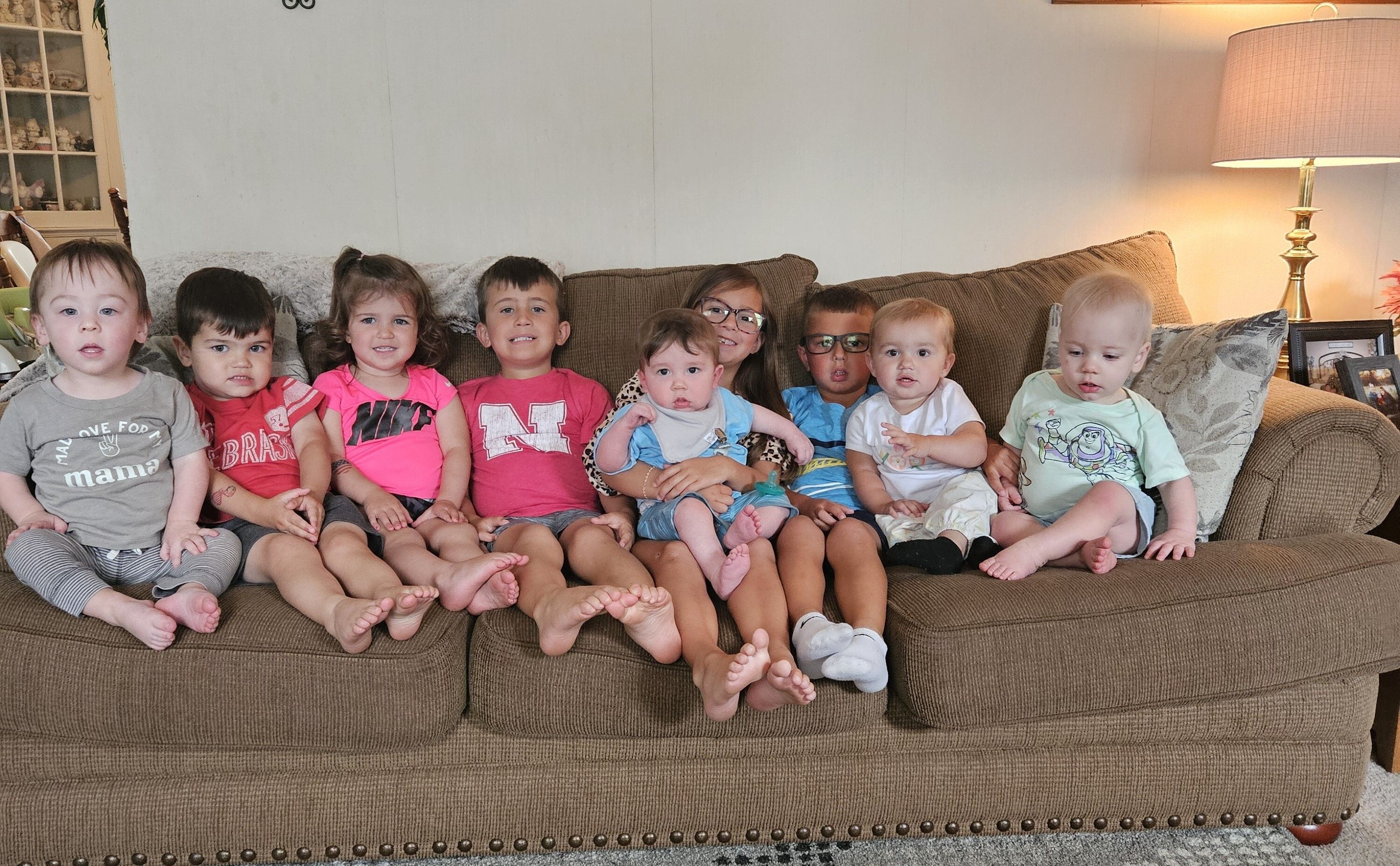 Children at Nae's Home Away from Home childcare sitting on a sofa