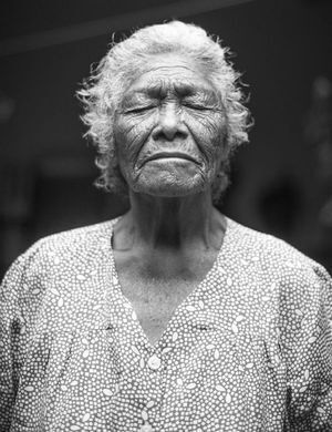 Elder woman afraid of her abuser.
