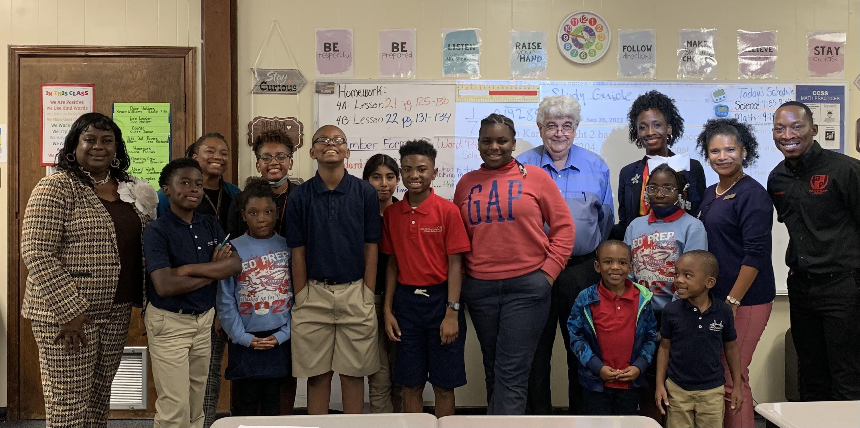 LSU Math professor, Dr. Frank Neubrander, stands with GEO Prep Academy Math Club students and faculty 