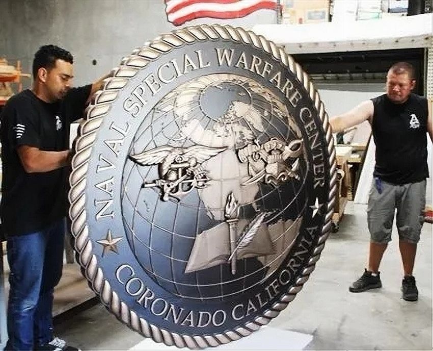 TA3046 - 7 ft diameter wall plaque for the Naval Special Warfare Center in San Diego,  carved in 2.5-D multi-level relief and plated with bronze metal 