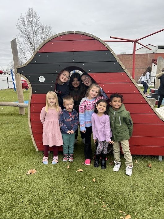 Children running and playing outside of school