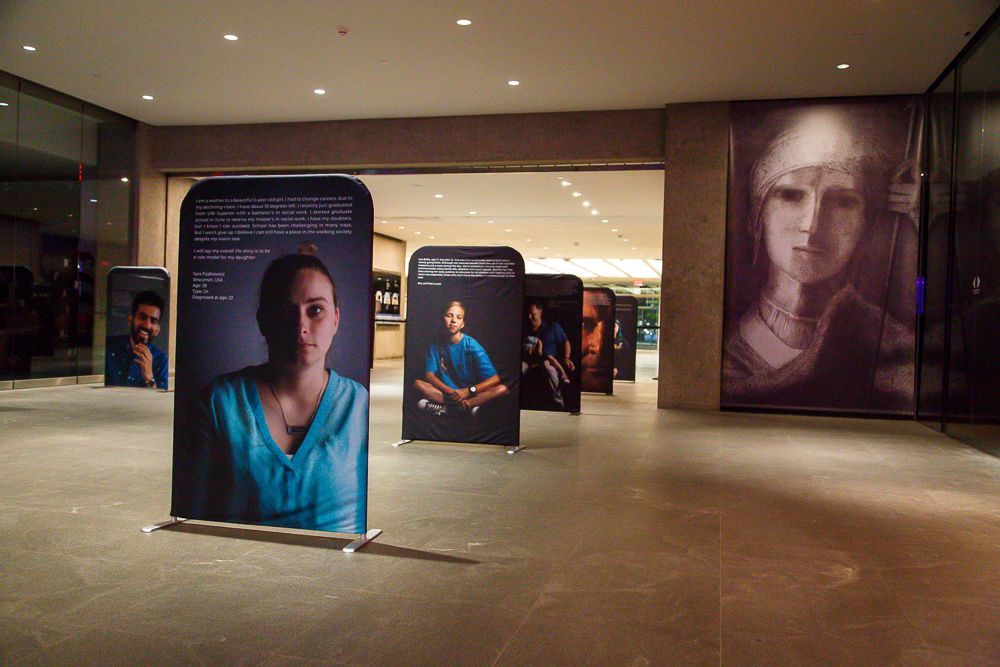 A row of portraits are shown in the Cleveland Museum of Art space. 
