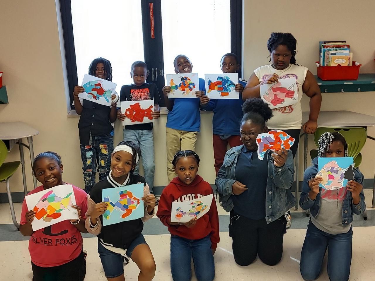 Timmonsville Club members hold up their artwork.