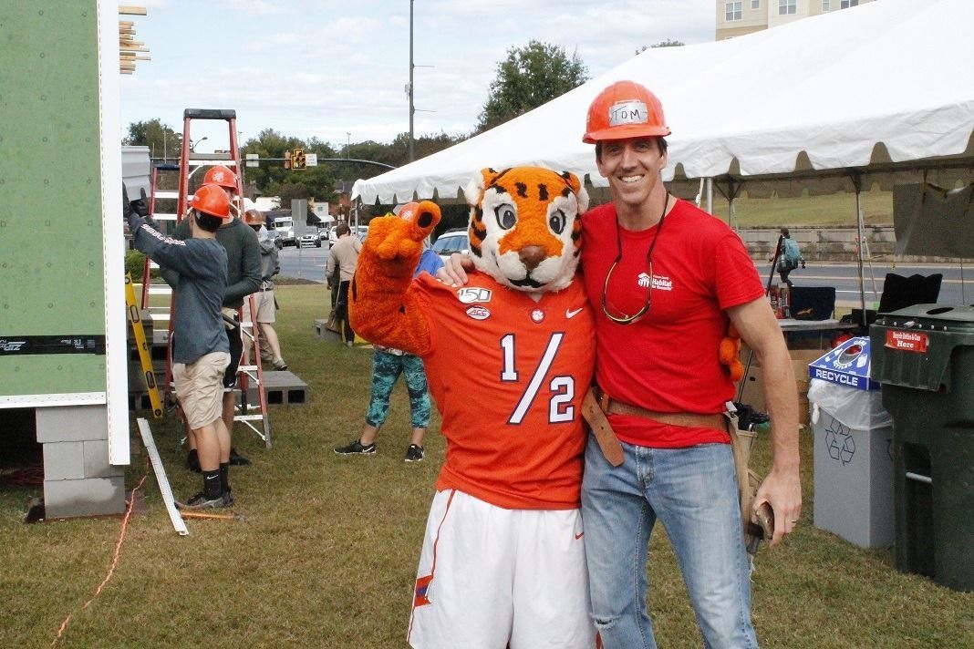 Former Campus Chapter Tom DiAntonio poses with Clemson University Tiger Mascot in front of the 2019 Homecoming Build.