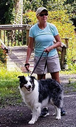 Woman walking her dog.