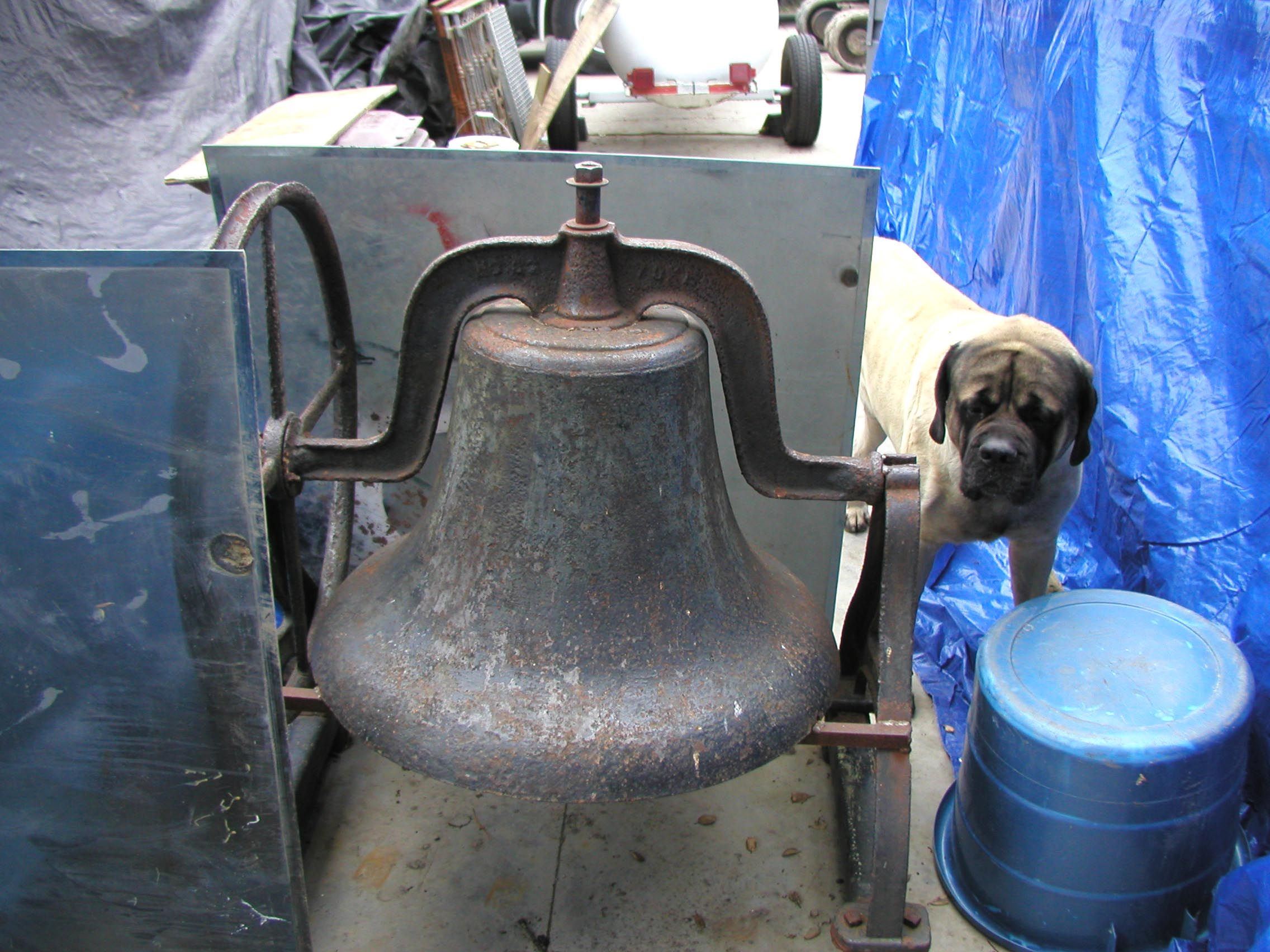 Damaged Old School Bell stored outside