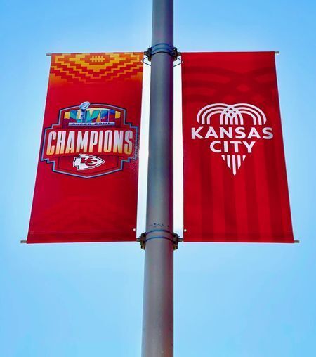 Champions LVII Banner next to Champions Pole Banner