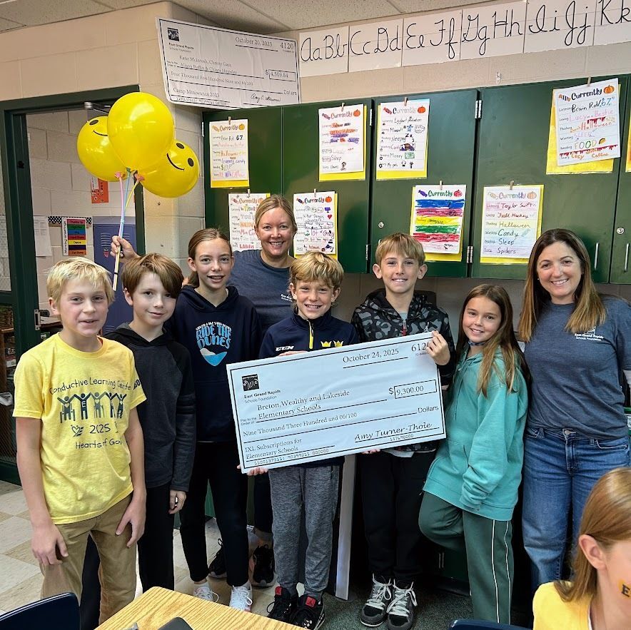 students and Foundation board members with big check for IXL grant