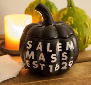 black porcelain pumpkin with text: salem mass. est 1629