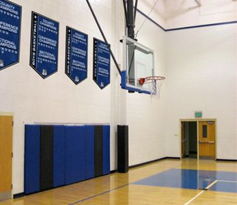 School gym with championship boards that add a year for each championship, custom signs