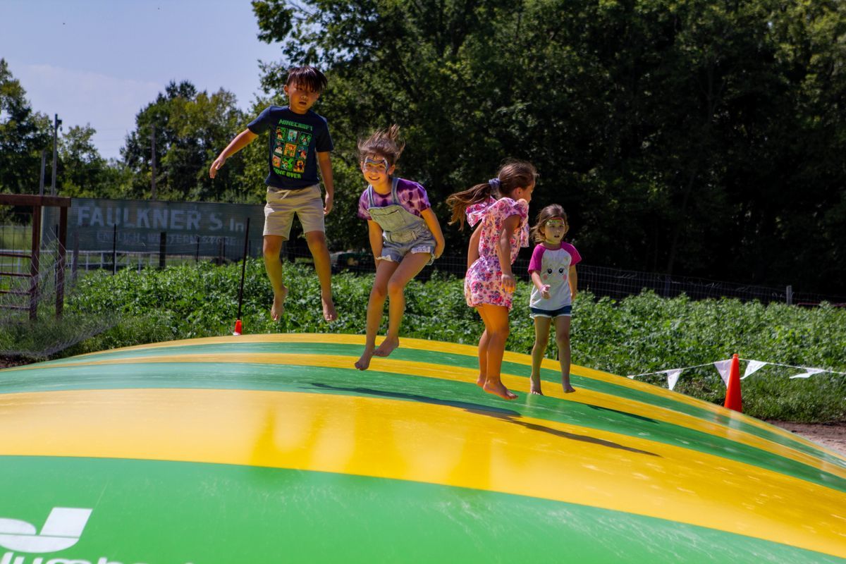 children bouncing on Jumbo Jumper