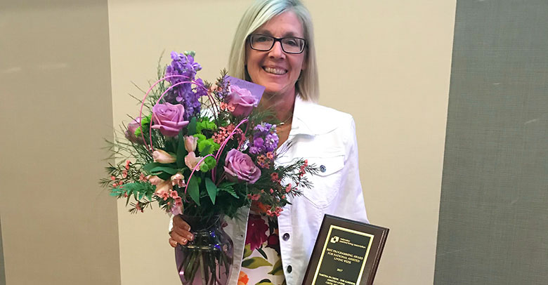 Kim Sasek accepts the NALA Award