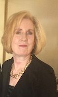 Kathryn Grant. A woman who is in her 50's-60's. She has blond hair and she is wearing a suit. She is also posing for the picture.