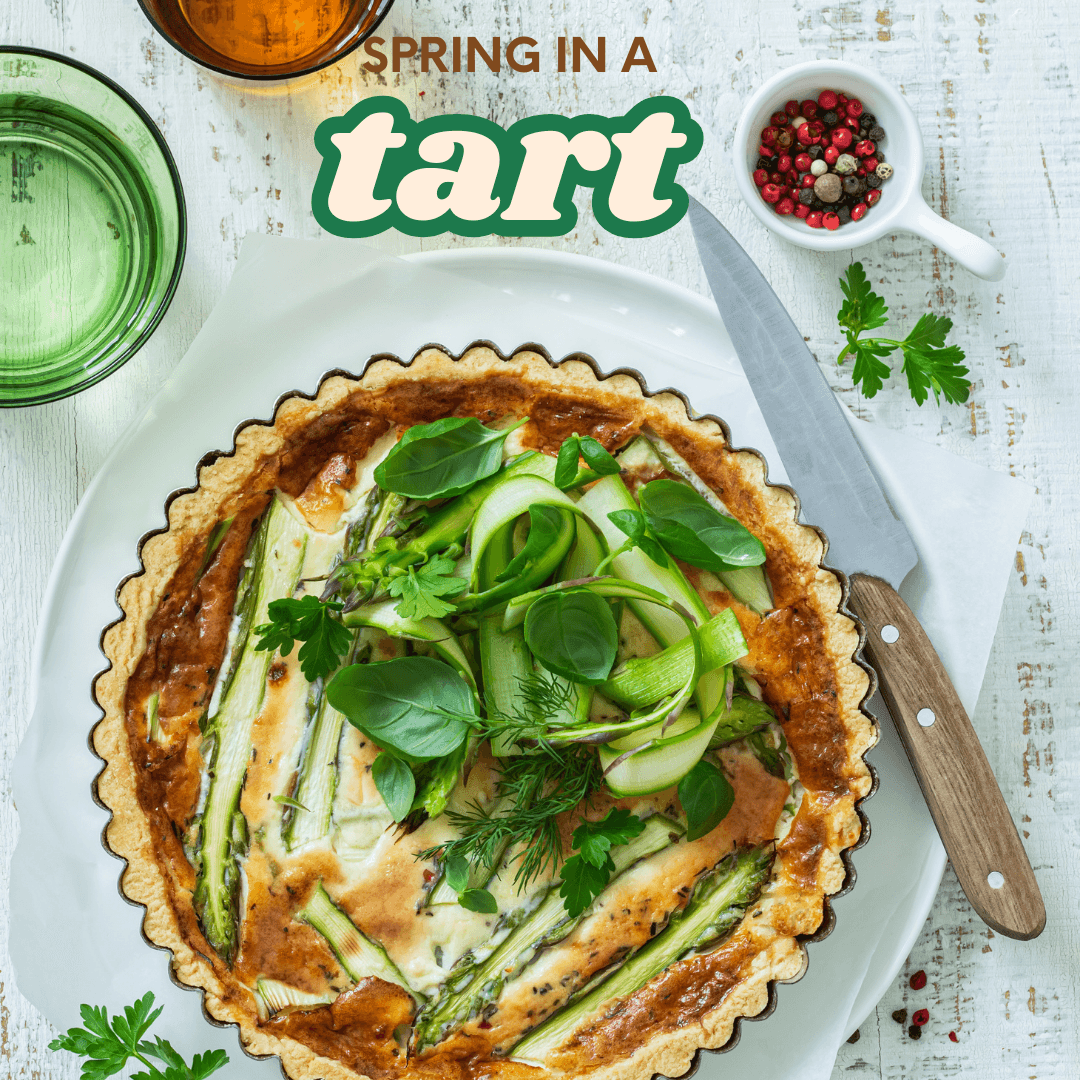 Vegetable tart on serving dish with cups of dipping sauces