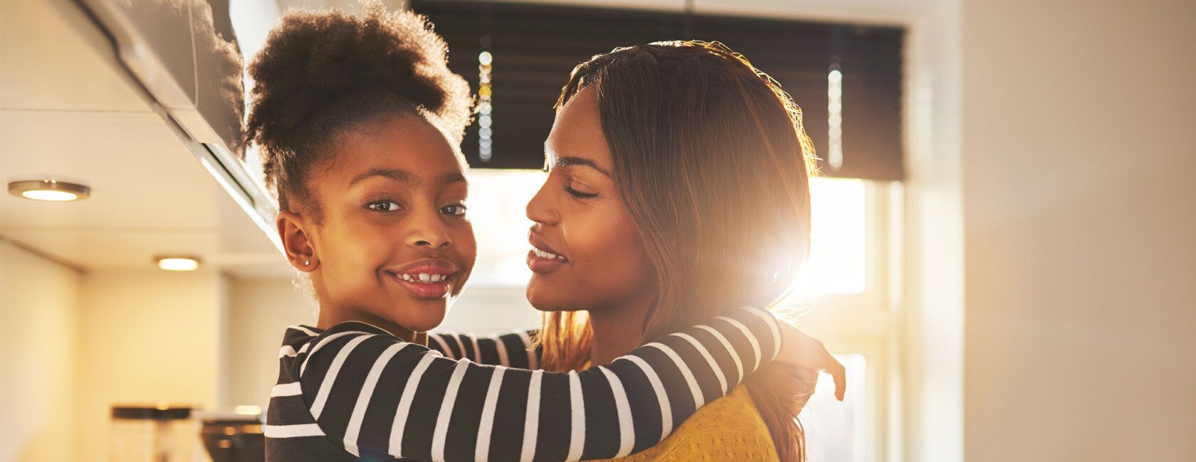 Mom holding daughter