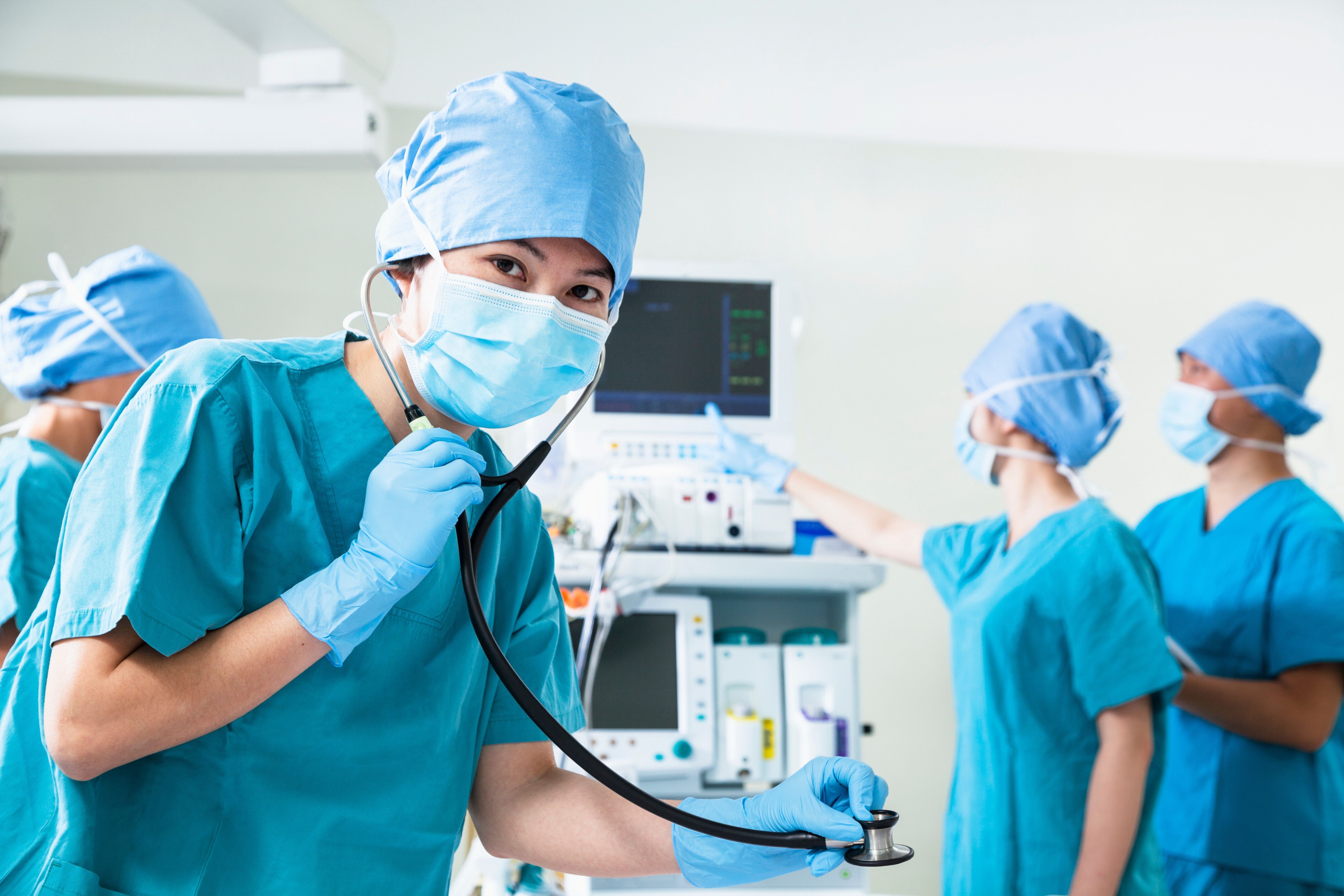 Group of nurses in blue scrubs