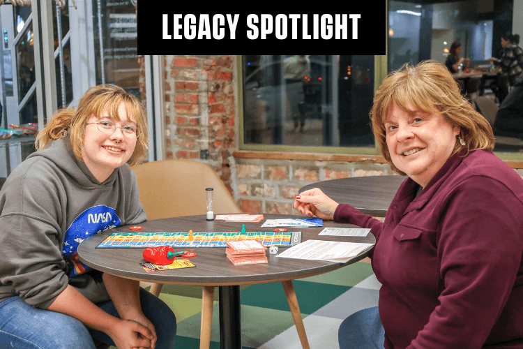 Mentor and mentee posing together with the words Legacy Spotlight added to the graphic