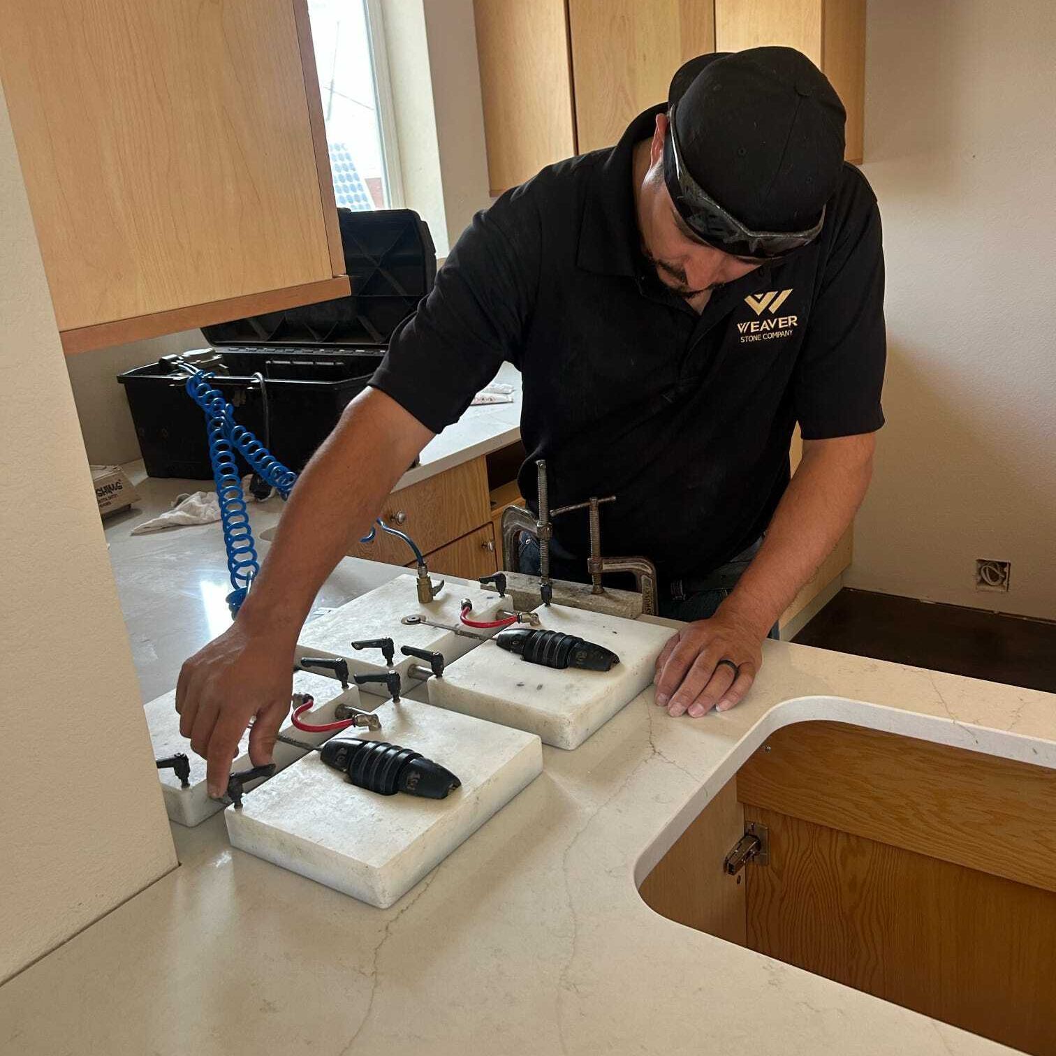 Weaver Stone Company installing countertops at Addison's house