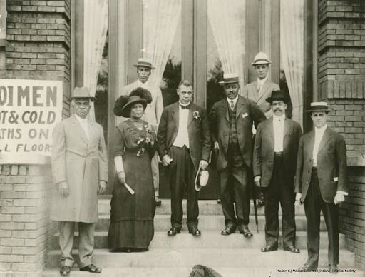 Madam C.J. Walker (second from left) stands next to fundraiser and educator Booker T. Washington (holding hat in hand) at the dedication of the Senate Avenue YMCA in Indianapolis. Photo courtesy of the Indiana Historical Society.