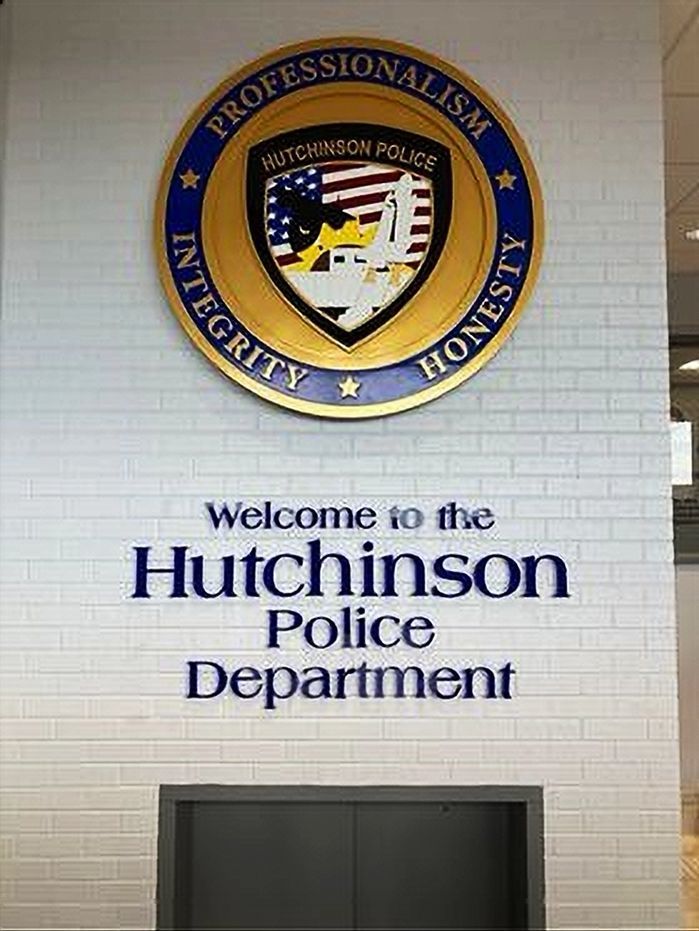 PP-2010 -  Carved 3-D HDU Plaque of the Shoulder Patch of the Hutchinson Police Department, and Letters Below the Plaque