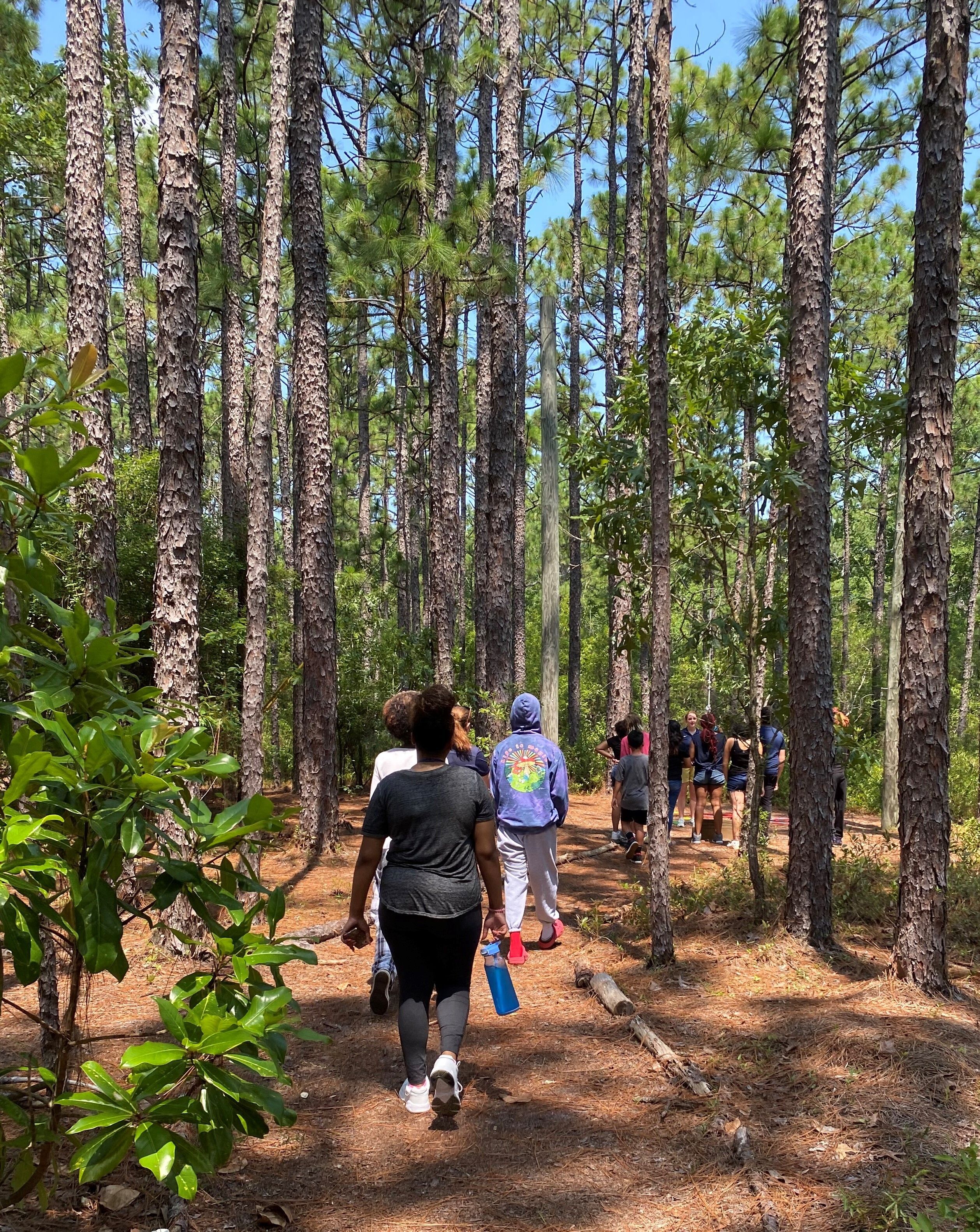 Boys and Girls Homes residential students visit UNCW ropes course for first time