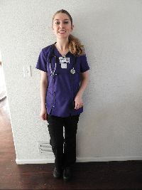 Jazmine wearing nursing scrubs