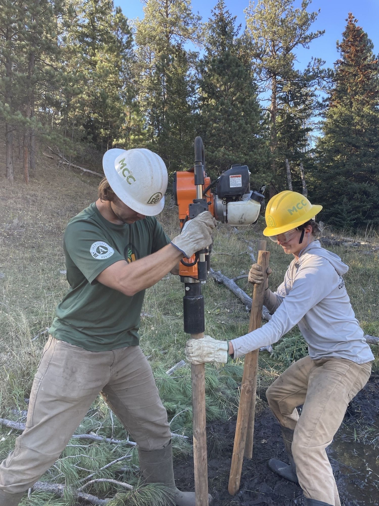 Two crew members work on a BDA together.