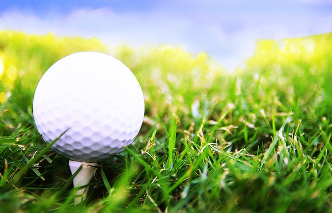 close up image of a golf ball on a tee