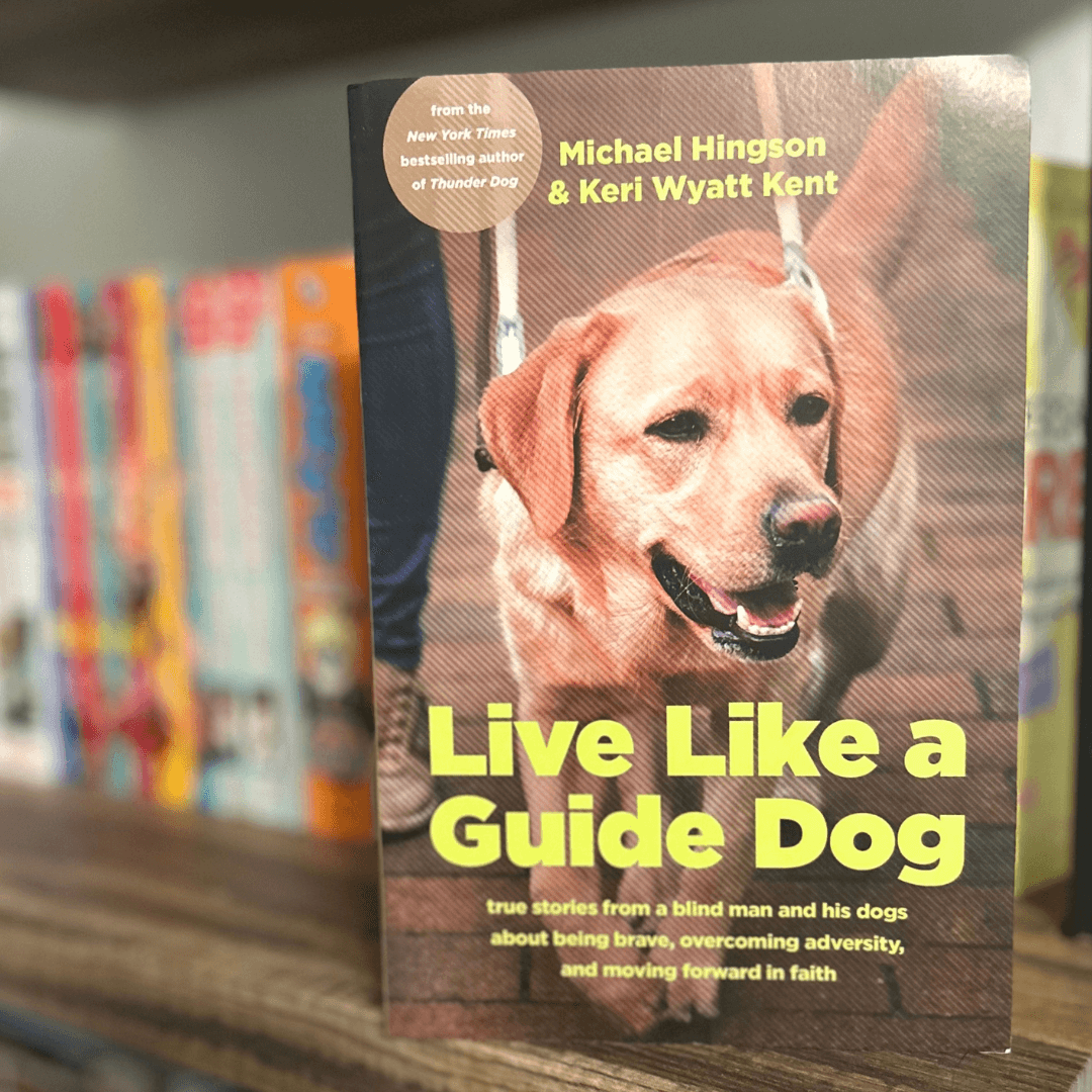 accessiBe CVO Mike Hingson's new book, sitting on a bookshelf, pictures his dog on the front cover, "Live Like a Guide Dog" is the title. Michael is Unstoppable. #WeAreUnstoppable