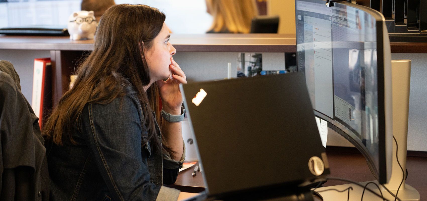 Person looking intently at computer screen.