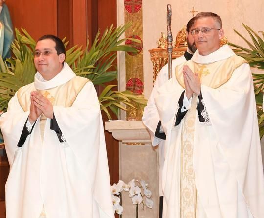 Bishop ordains two to the priesthood