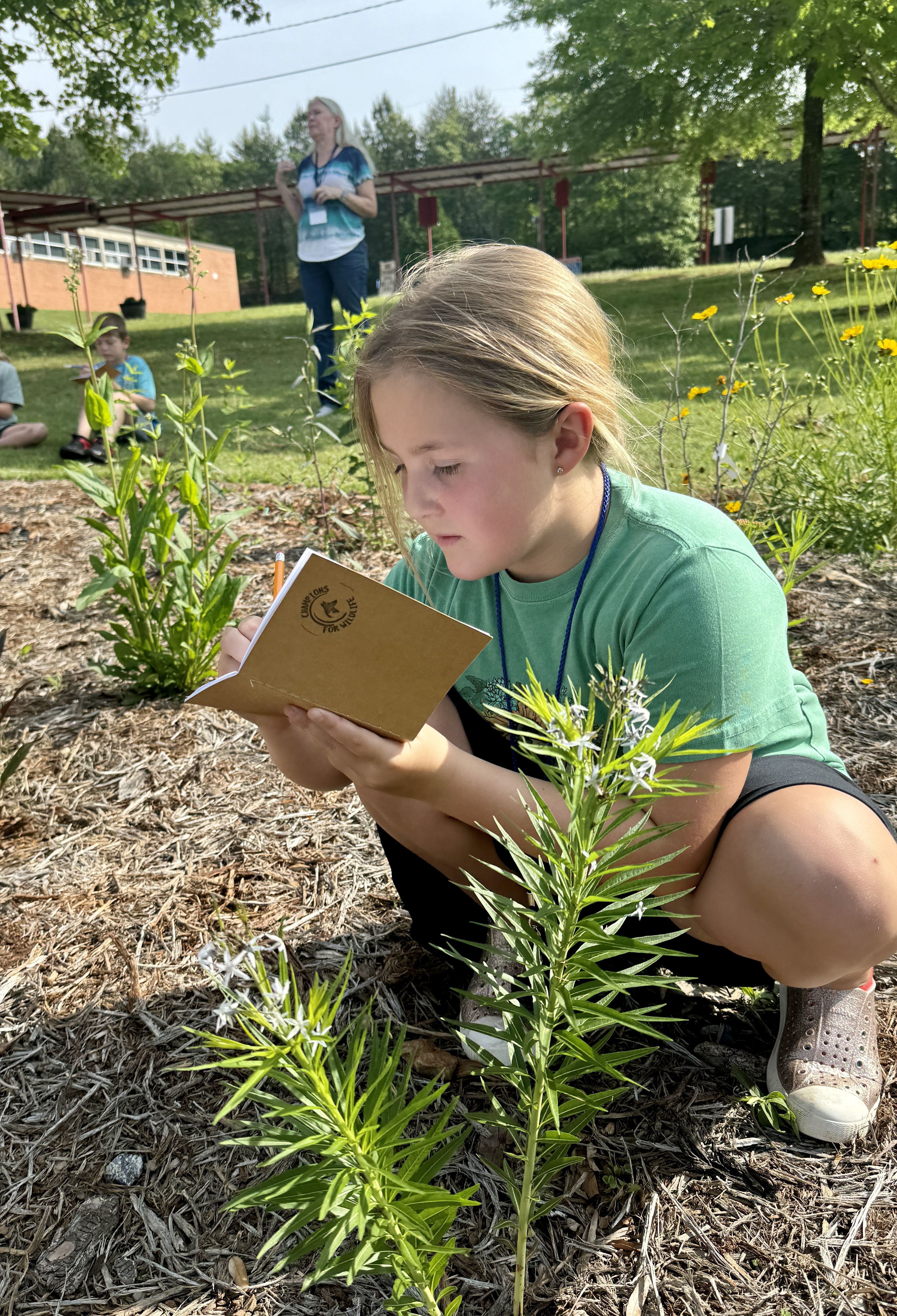 Young boy looking through a magnifying glass