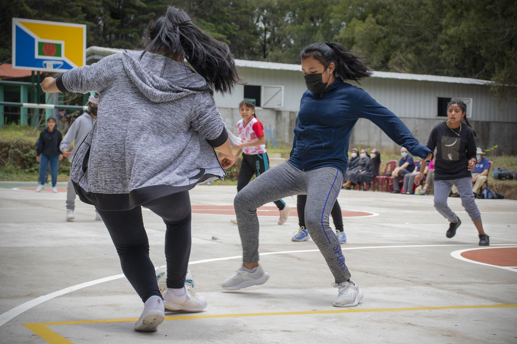 Students play soccer on the new court!