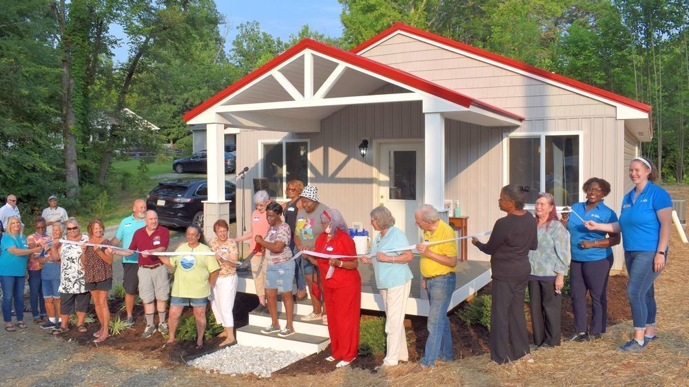 Habitat homeowner cuts ribbon on new home