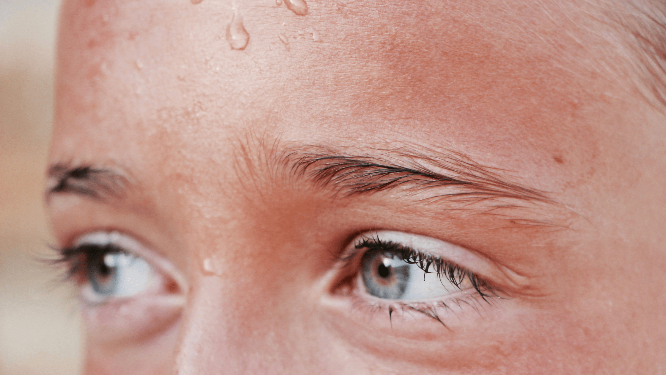 person with sweaty forehead looking distressed