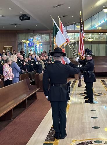 The Pledge of Allegiance is recited by those attending the Blue Mass Sept. 29, 2023