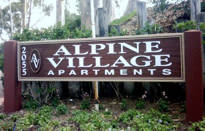 M4794 -  Two  8 " x 8" Cedar Wood Side Posts with Ball Finials Supporting Large  Redwood entrance sign for Alpine Village Apartments   