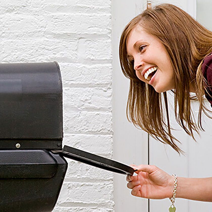 Woman checking  her mailbox.