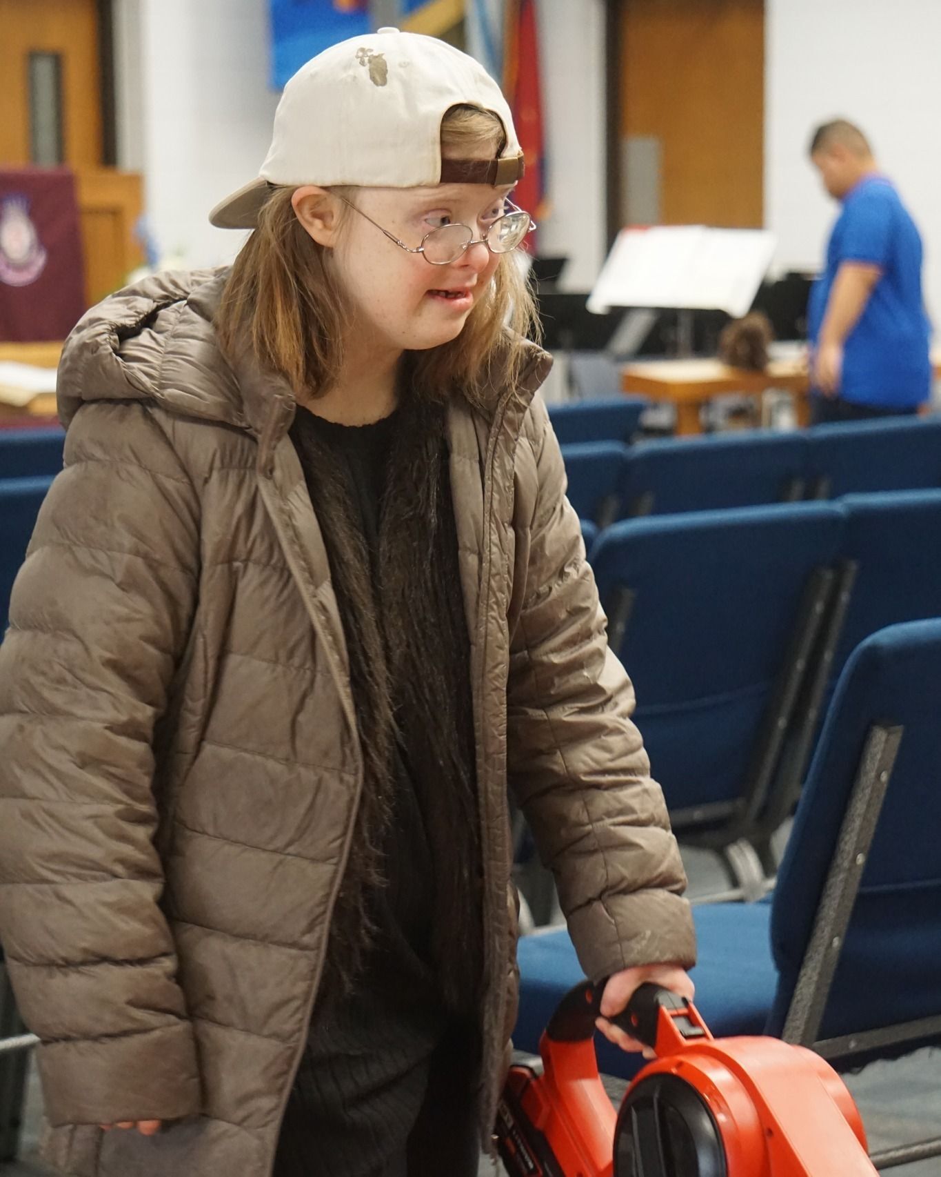 A crew of volunteers work to keep the Salvation Army building clean for the community