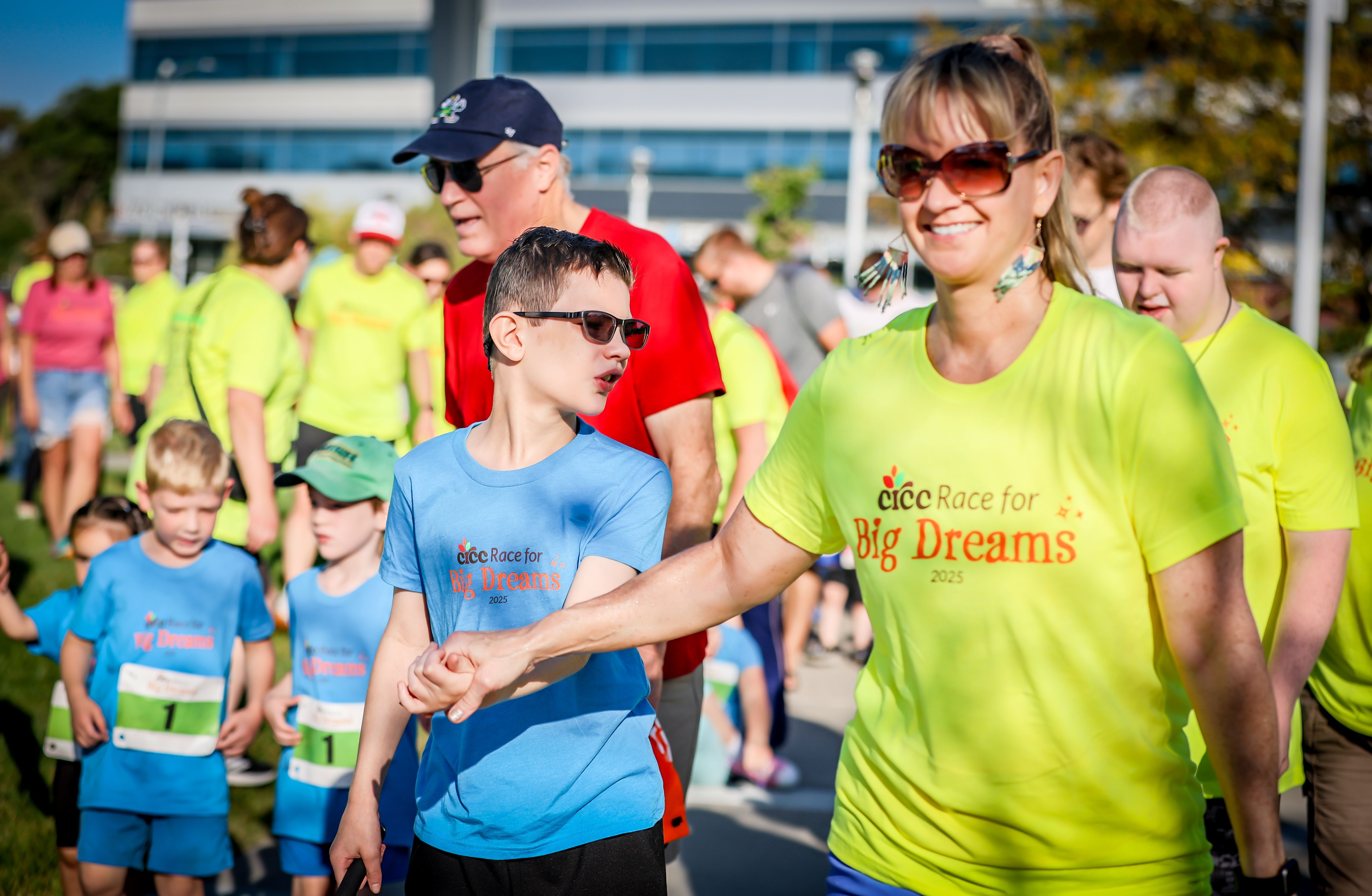 Mom and son walking together as part of the Race for Big Dreams