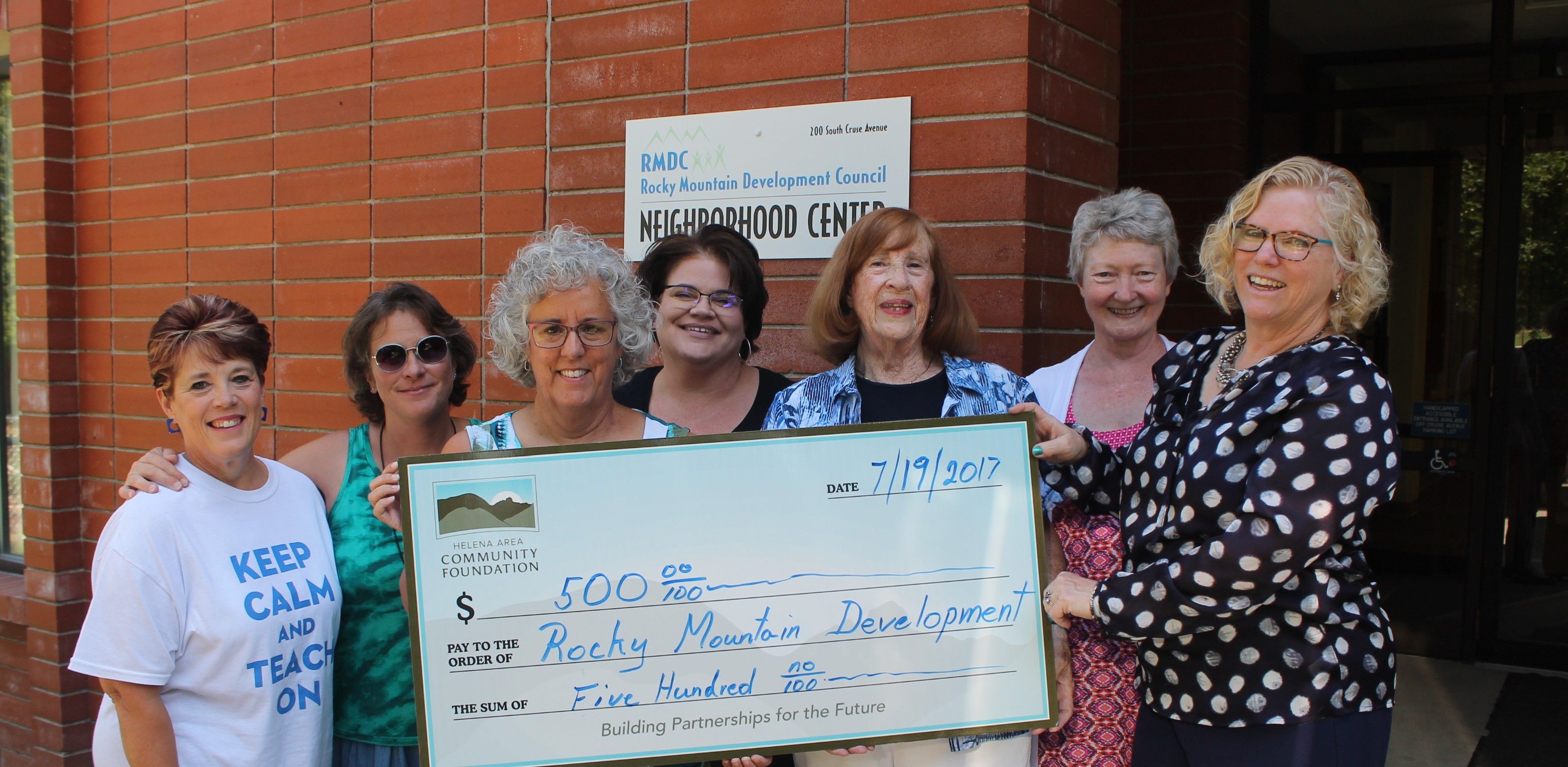Photo of Rocky receiving a check from the Helena Area Community Foundation for creating new brochures! 