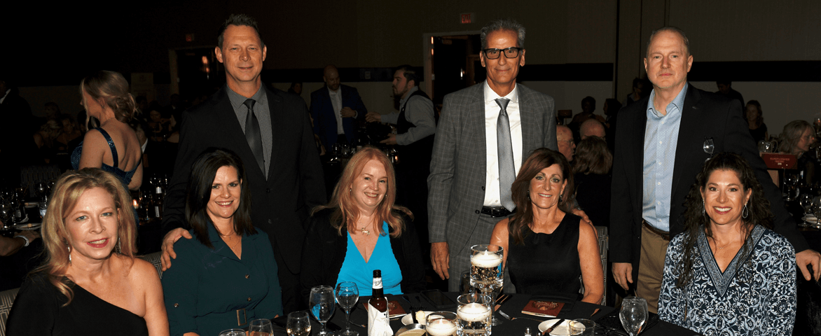 group of people at a fundraiser table
