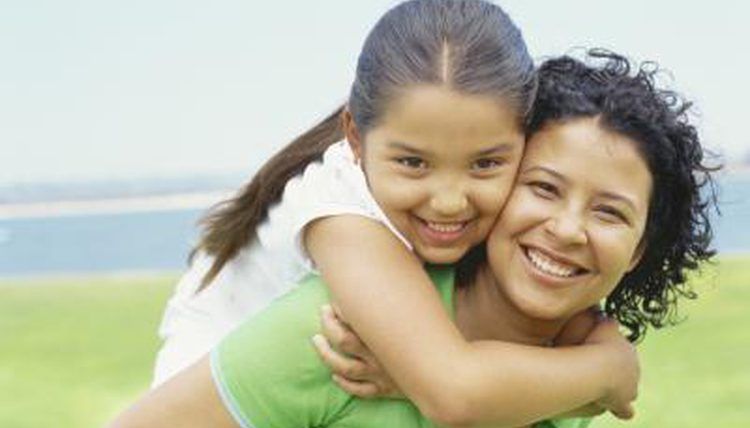 Young girl smiling with her CASA volunteer