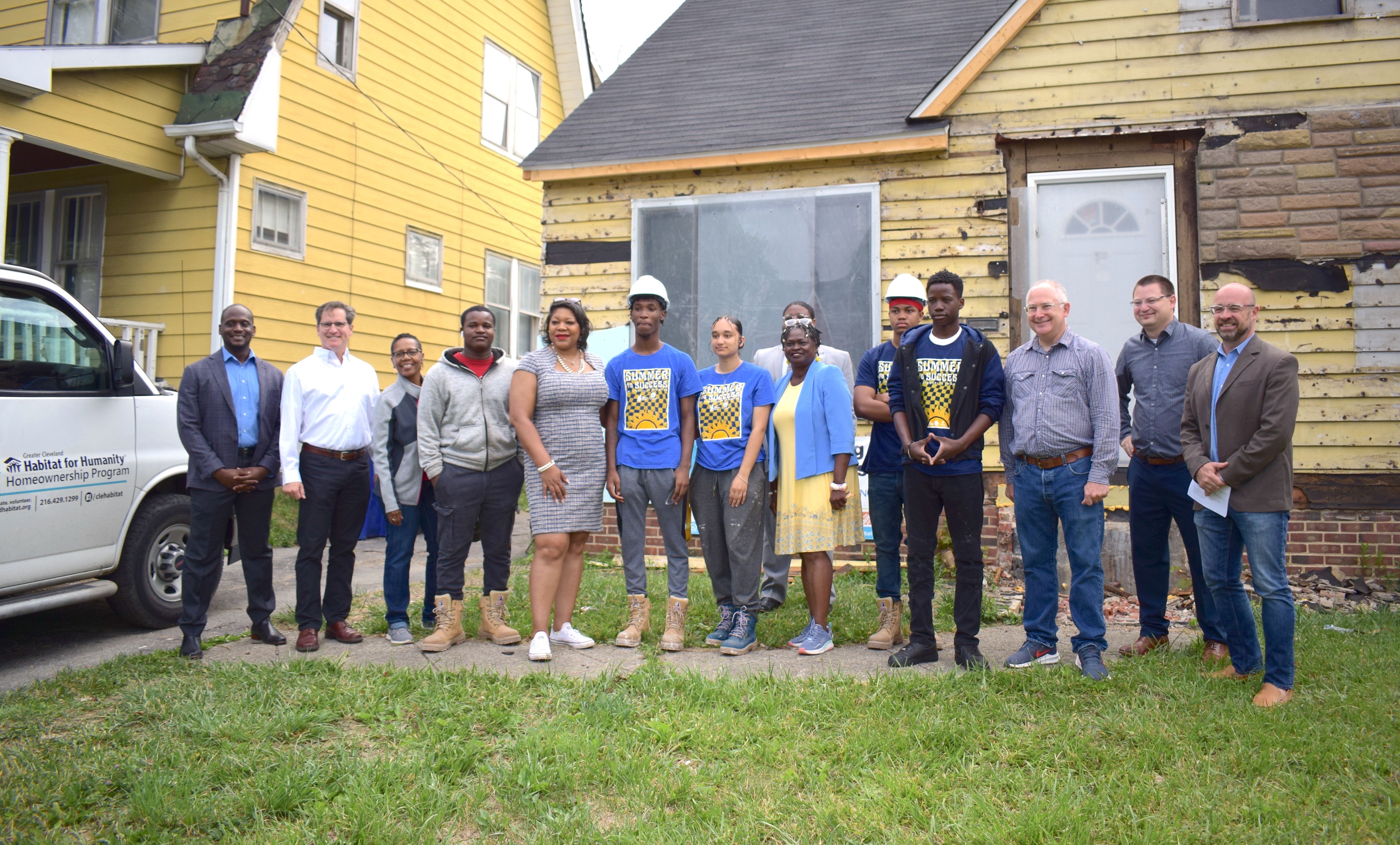 A group photo of those who attended a kickoff event for the 2023 Building Great Futures kickoff event held by Greater Cleveland Habitat for Humanity and Youth Opportunities Unlimited.