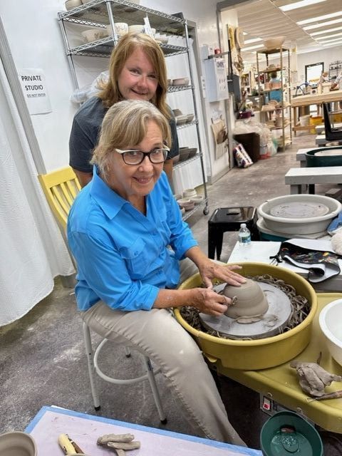 Pictured: Glenda Taylor of Indian River Clay at the wheel.  Marylou Robins, Vero Beach resident and volunteer looks on.