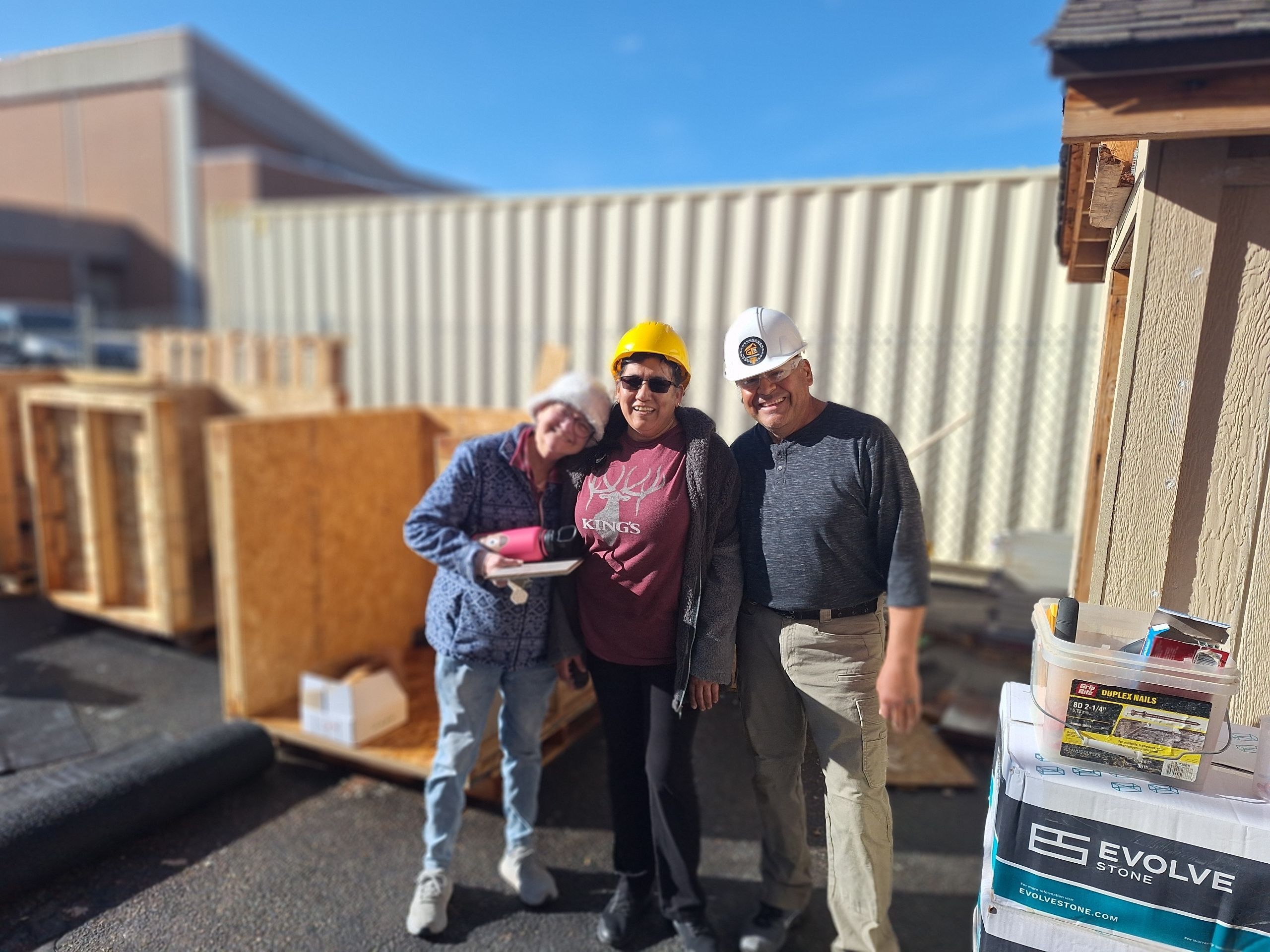 Abraham and Teresa with another homeowner (Trilby) working on her house.